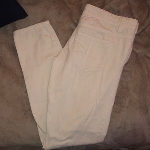White fairly worn straight leg jeans